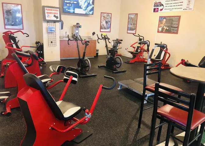 Recovery lounge with recumbent and spin bikes at HFH gym in Waupaca, WI