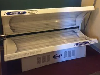 Clean, regularly serviced lay-down tanning bed at HFH gym in Waupaca, WI